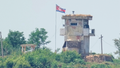 FILE: A soldier stands at a North Korean military guard post flying a national flag, seen from Paju, South Korea, Wednesday, June 26, 2024. - Fox News