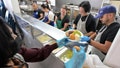 Volunteers serve up plates filled with all of the traditional Thanksgiving food at the Long Beach Rescue Mission in Long Beach on Wednesday, November 22, 2023. - Fox News