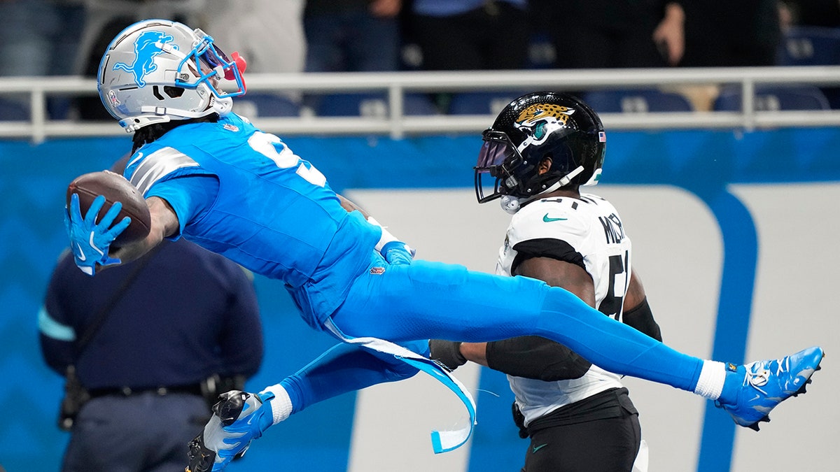 Jameson Williams celebrates touchdown