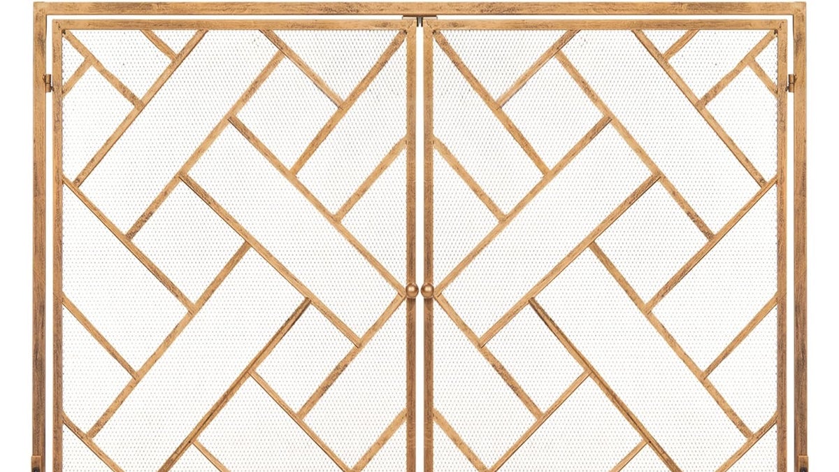 A stylish decorative fireplace screen at Amazon will elevate the look of your room and keep embers in.