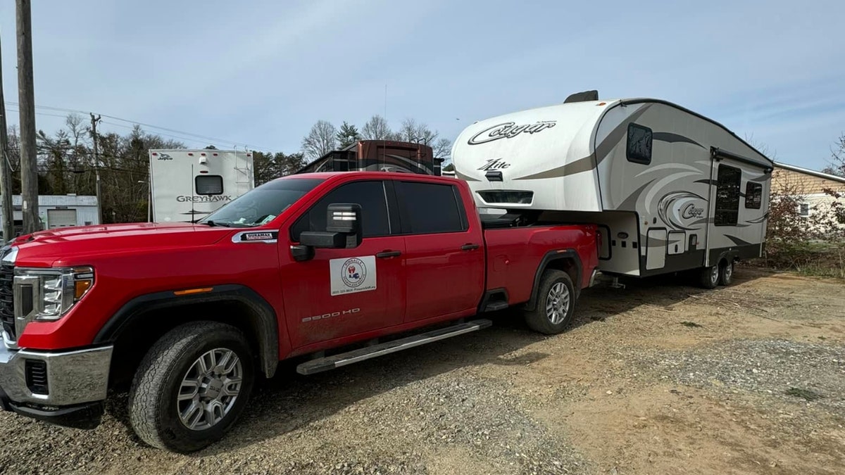 A Cajun Navy truck hauls campers.