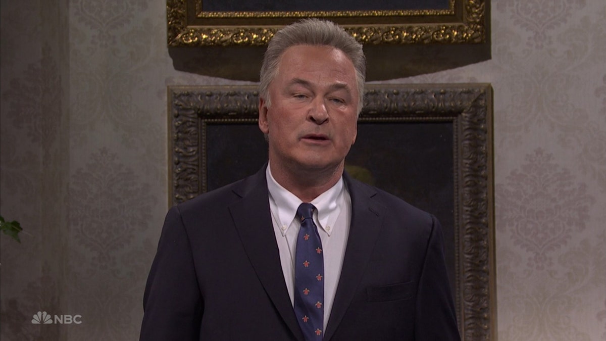 Alec Baldwin wears suit and tie as RFK Jr. on SNL