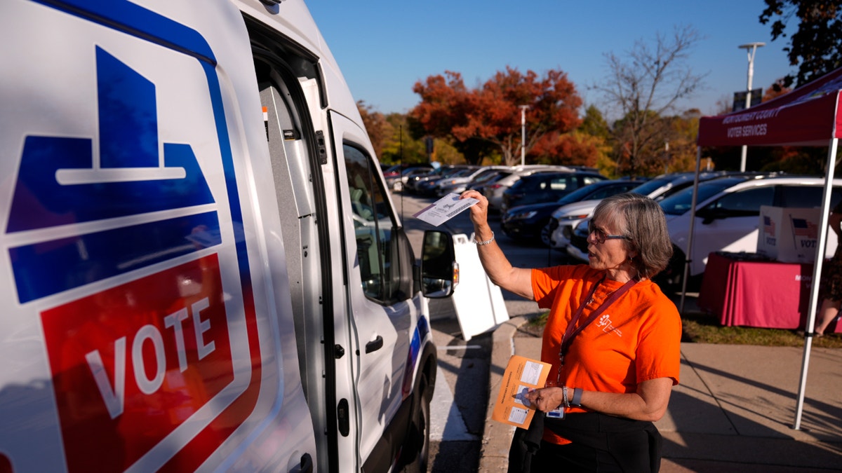 voter voting outside at election van