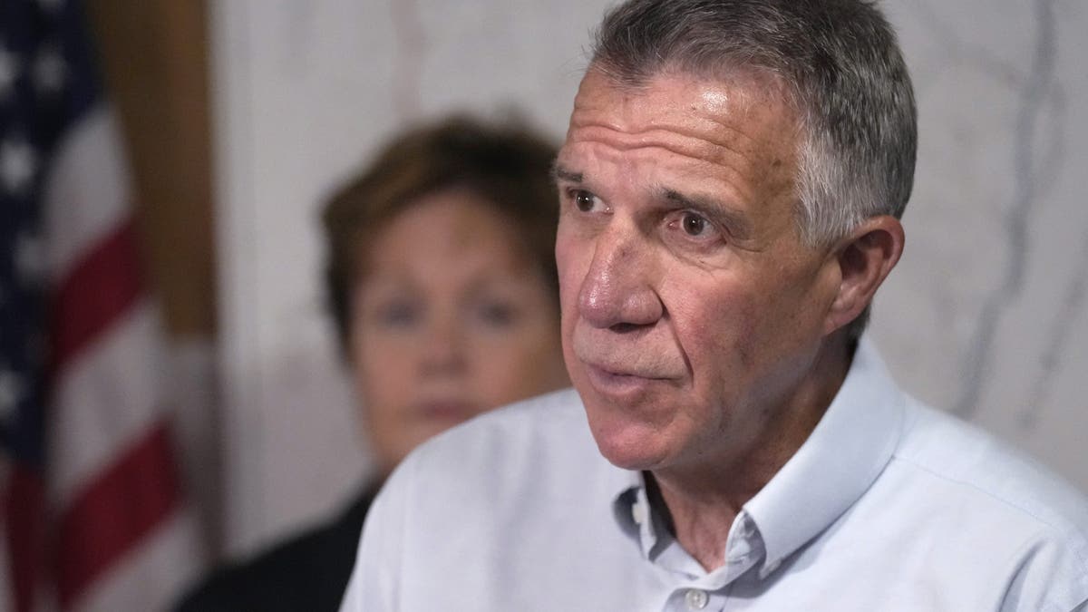 Republican Gov. Phil Scott of Vermont speaks with reporters in Berlin, Vt.