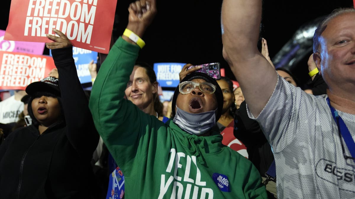 Attendees cheer as Minnesota Democratic vice presidential candidate Tim Walz speaks at a campaign event Monday, Nov. 4, 2024, in Detroit.