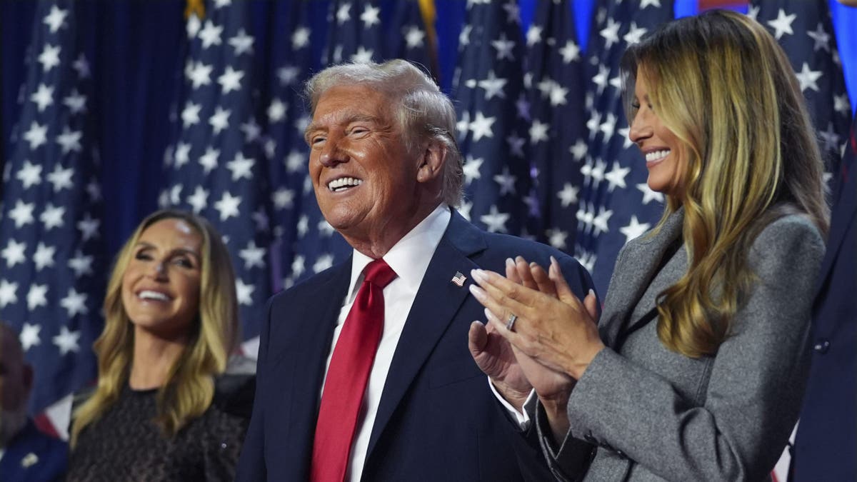 Trump smiles aft  2024 victory