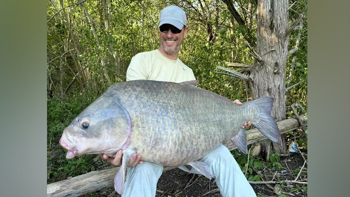 Art Weston of Kentucky holds smallmouth buffalo fish