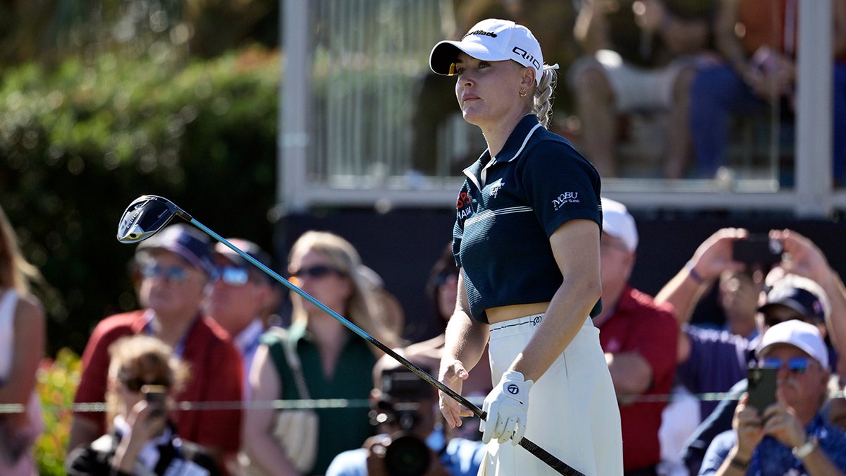 Charley Hull watches his tee shot