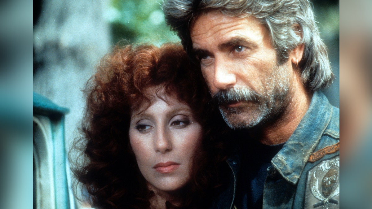 Cher and Sam Elliot look pensive in a scene from the "Mask"