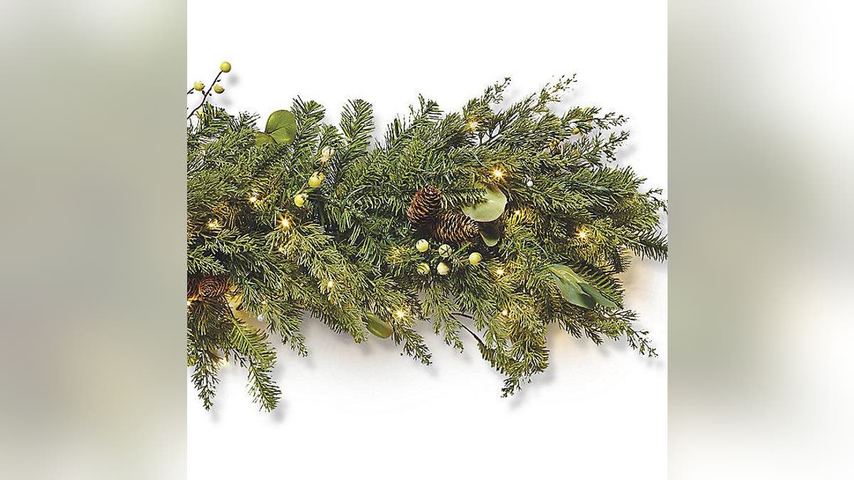 Set the scene for elegance with this Majestic Holiday 9-foot Corded Garland.