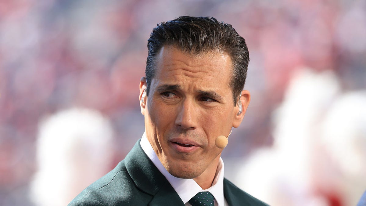 Brady Quinn looks on during an NFL game