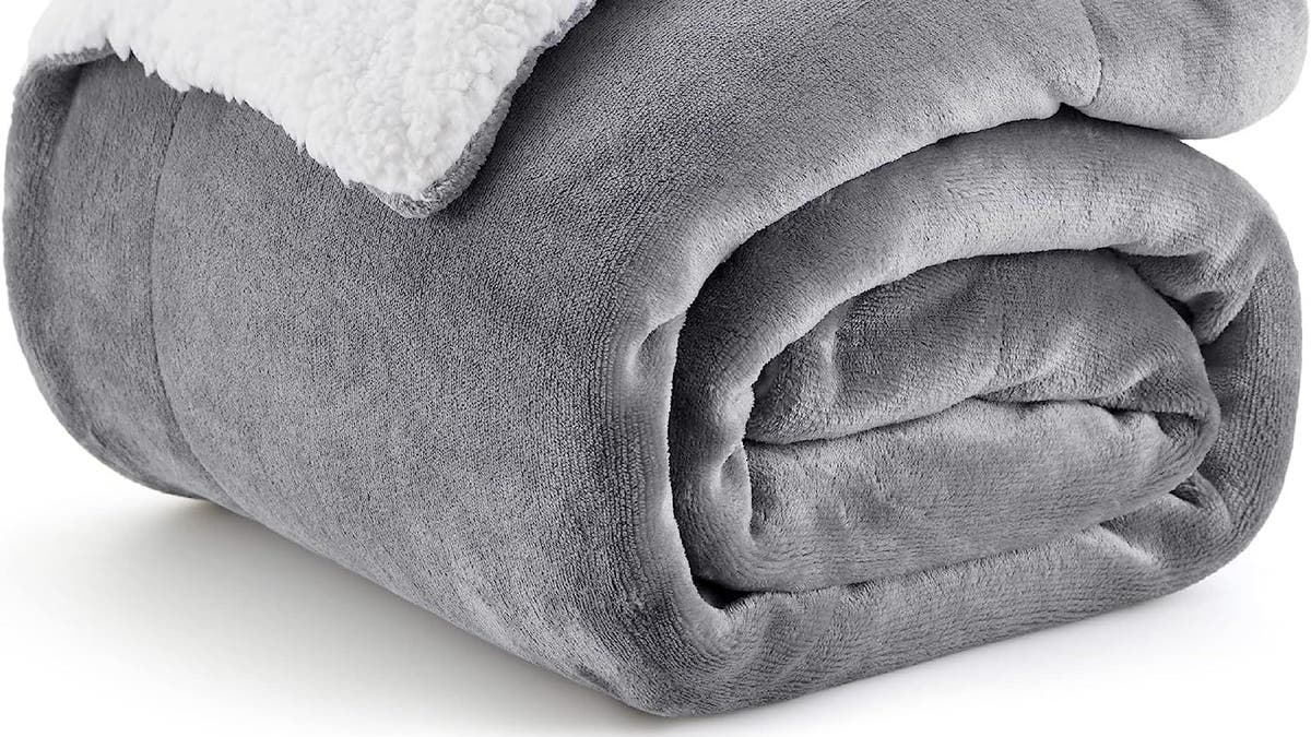 Keep cozy under this Sherpa throw.