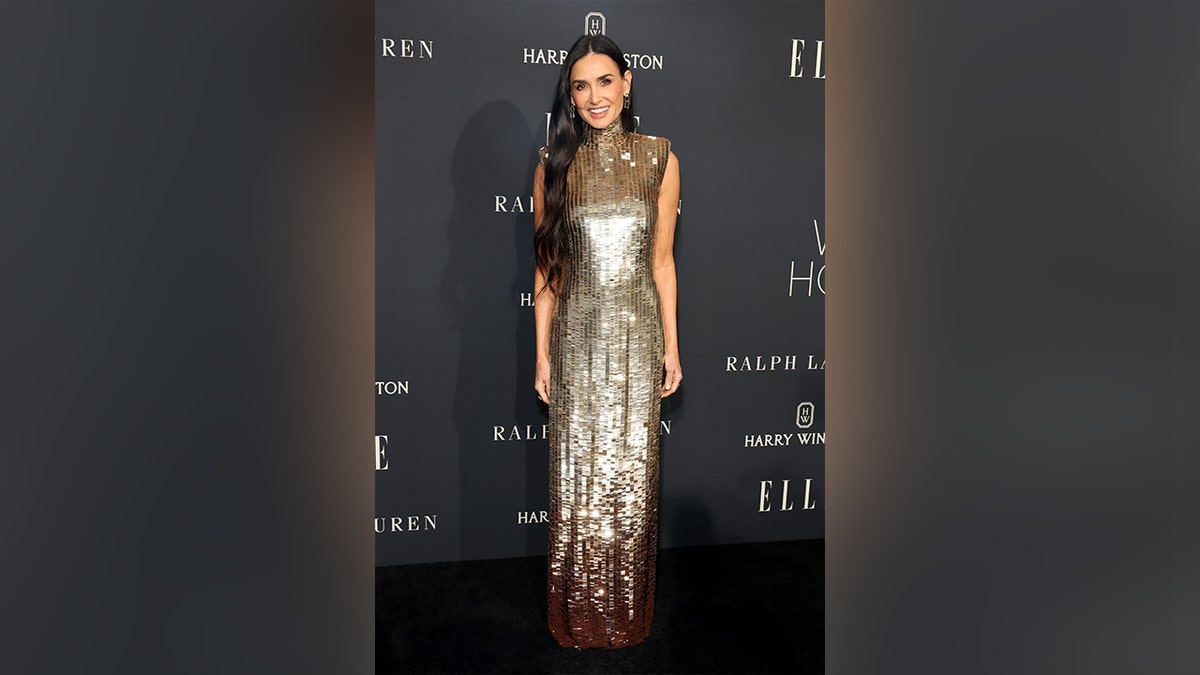 Demi Moore wore a gold Ralph Lauren dress to the Elle Women in Hollywood celebration event.