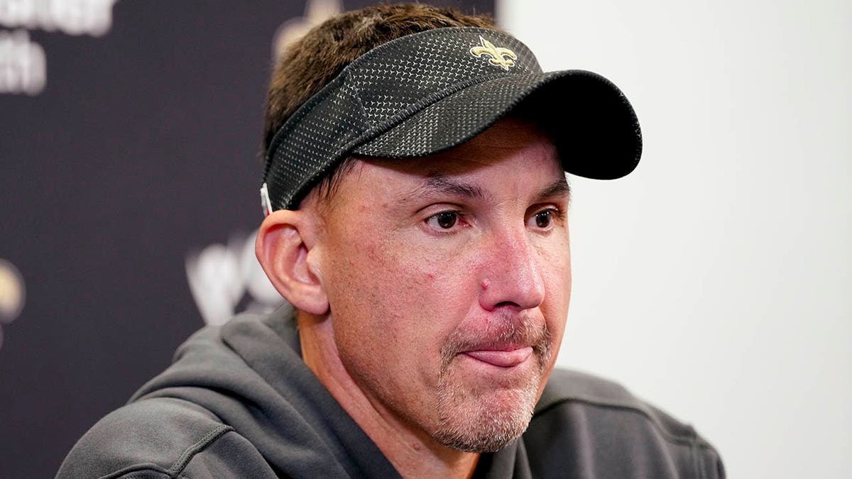 Dennis Allen talks to reporters