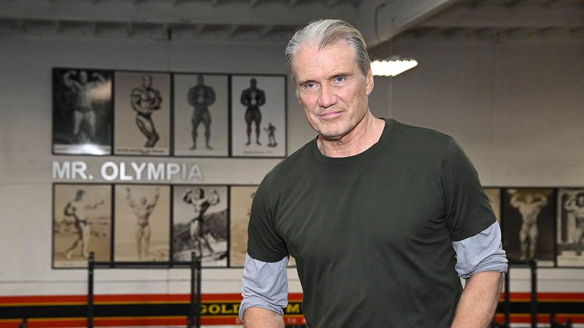 Dolph Lundgren posing in a boxing gym