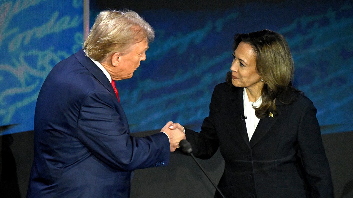 US Vice President and Democratic presidential candidate Kamala Harris shakes hands with former US President and Republican presidential candidate Donald Trump during a presidential debate at the National Constitution Center in Philadelphia, Pennsylvania, on September 10, 2024.