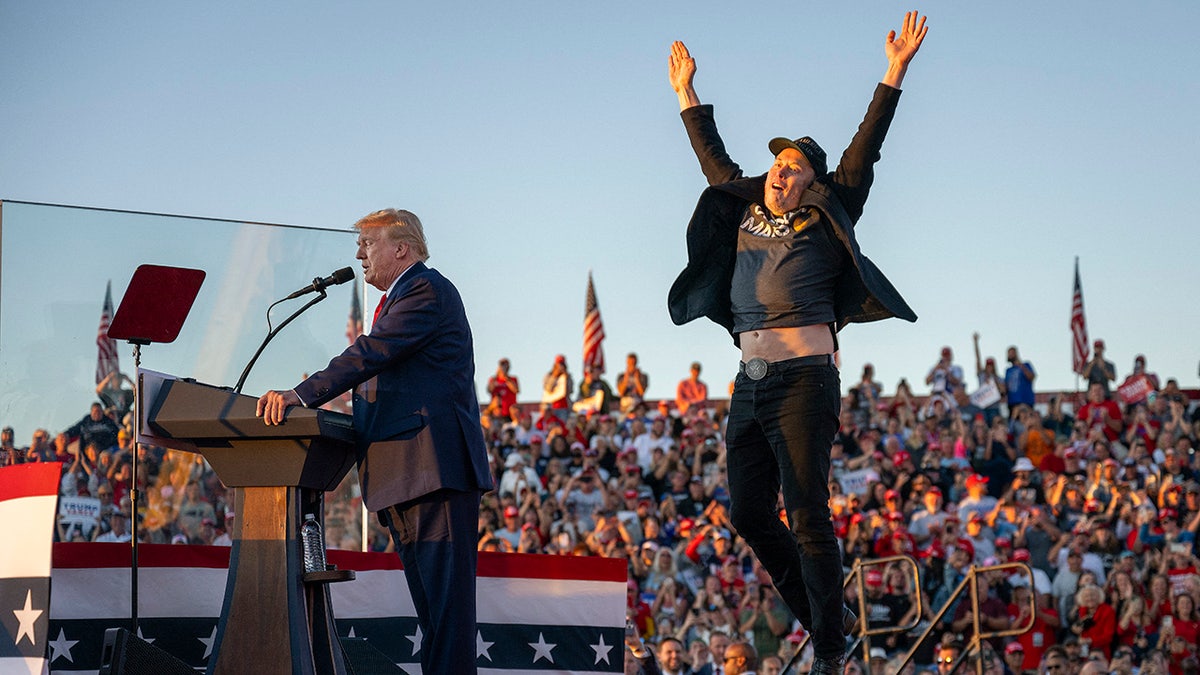 Tesla CEO Elon Musk takes the stage as he joins former US President and Republican presidential candidate Donald Trump on his campaign trail at the site of his first assassination attempt in Butler.