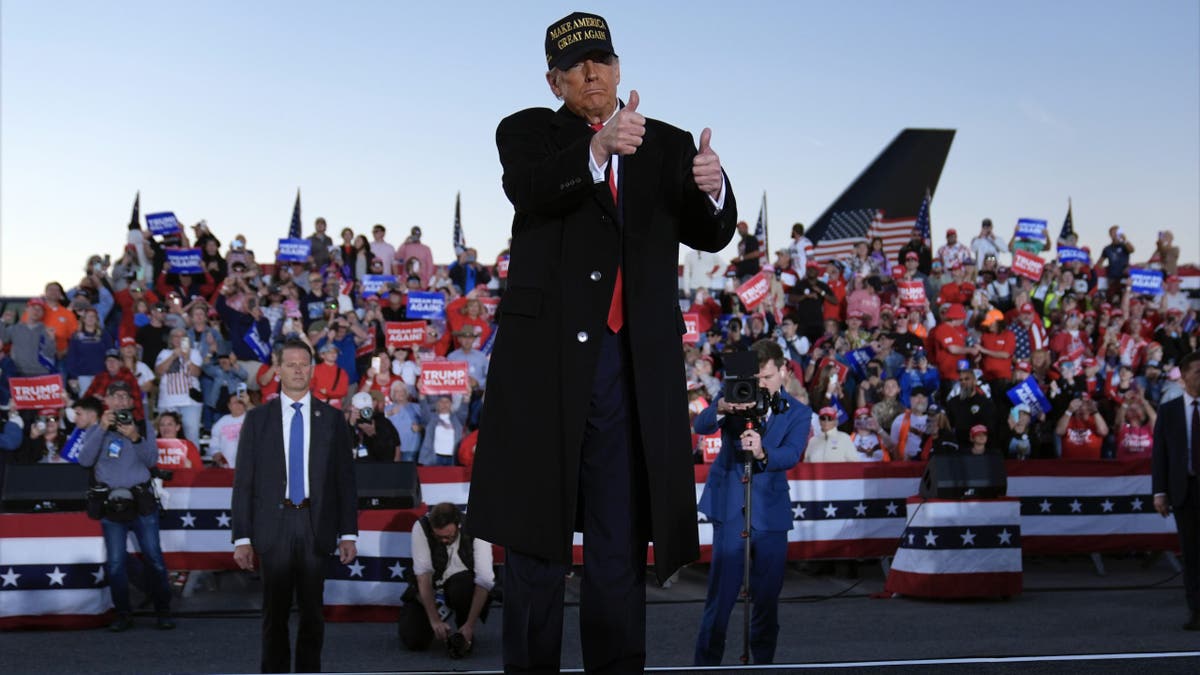 Republican presidential candidate former President Donald Trump gestures at a campaign rally at the Kinston Regional Jetport on Sunday, November 3, 2024 in Kinston, North Carolina.