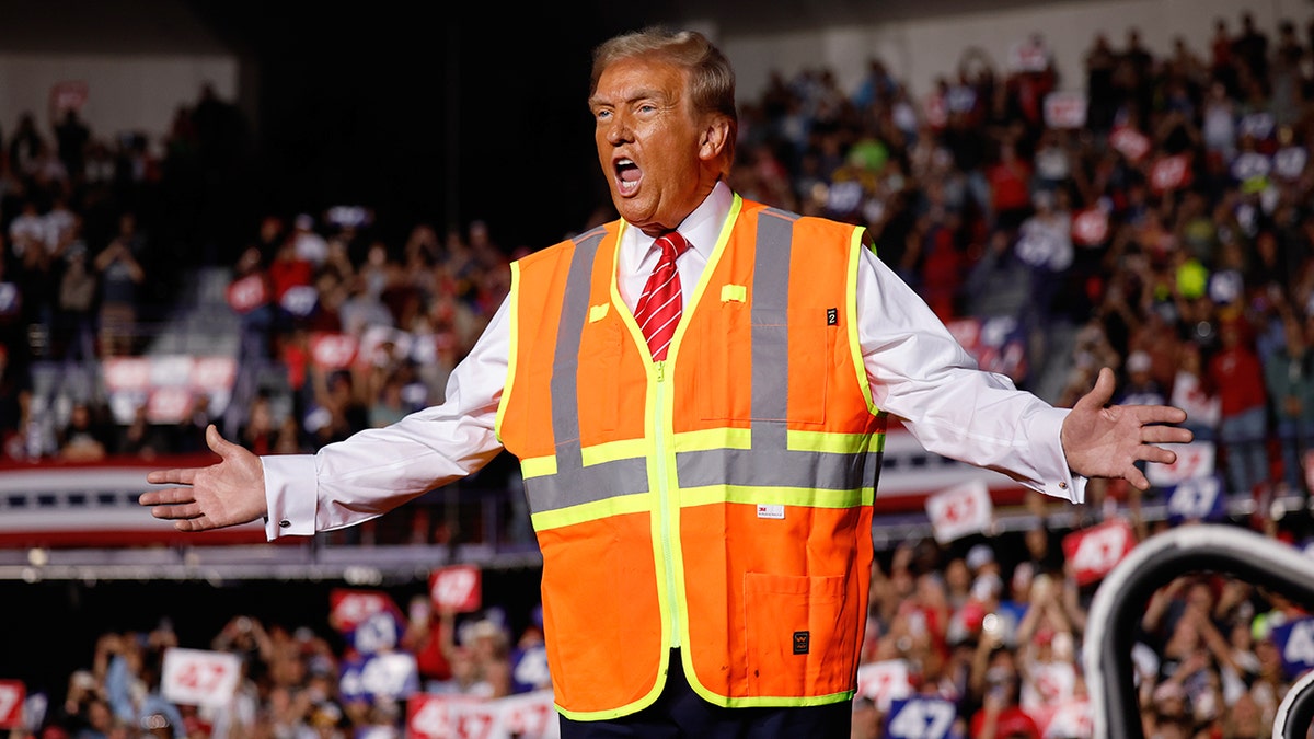 Donald Trump wears an orange vest