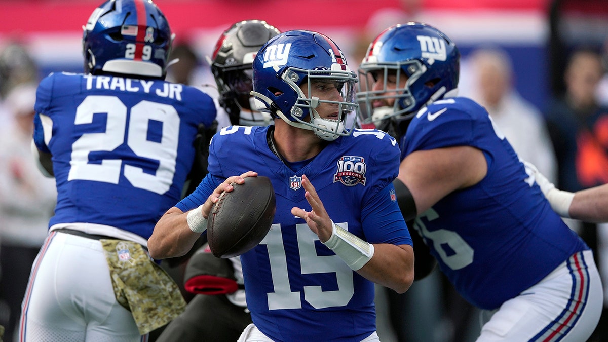 Tommy DeVito throws a pass