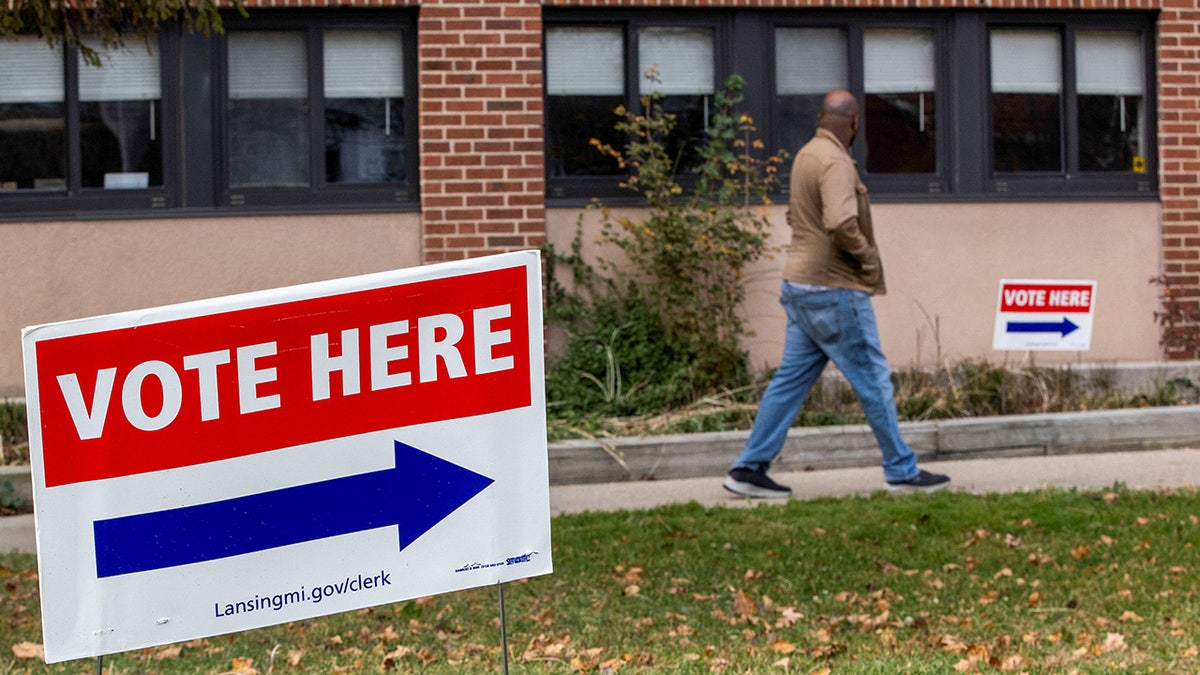 A person arrives at a polling place to cast their early vote on the last day of early voting in Michigan