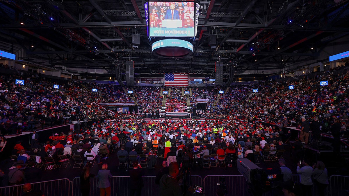 Donald Trump on stage in a long shot of the rally