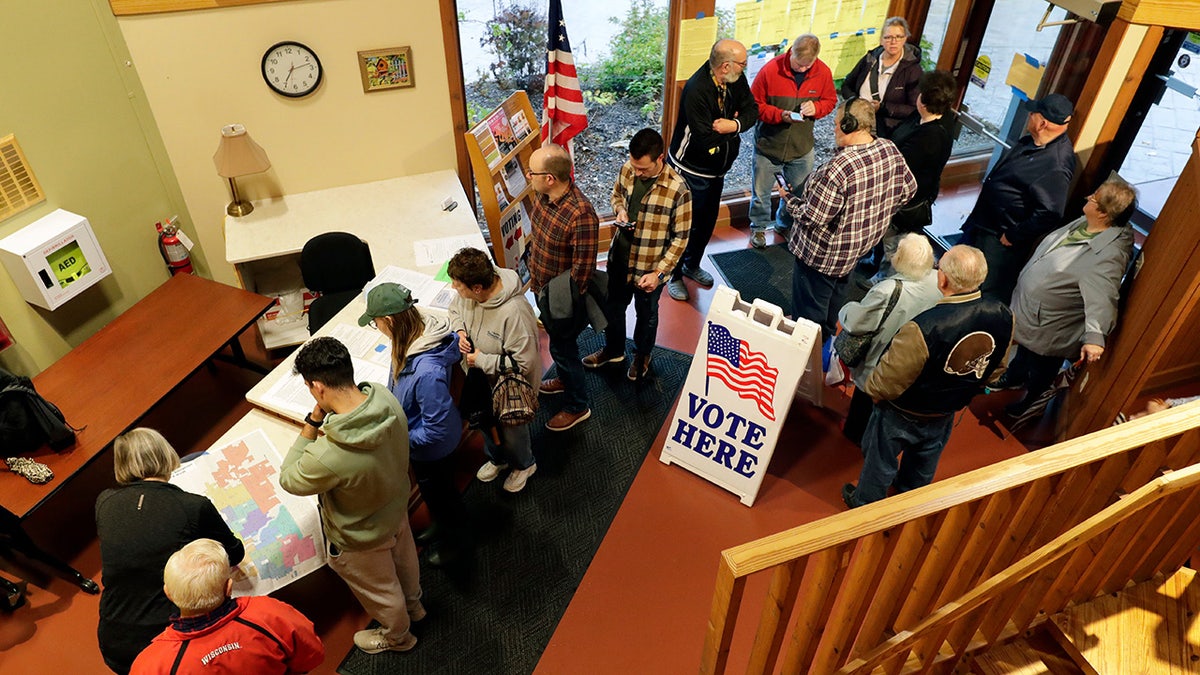 people queuing to vote