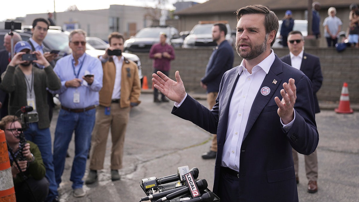 Republican vice presidential nominee Sen. JD Vance speaks outside after voting