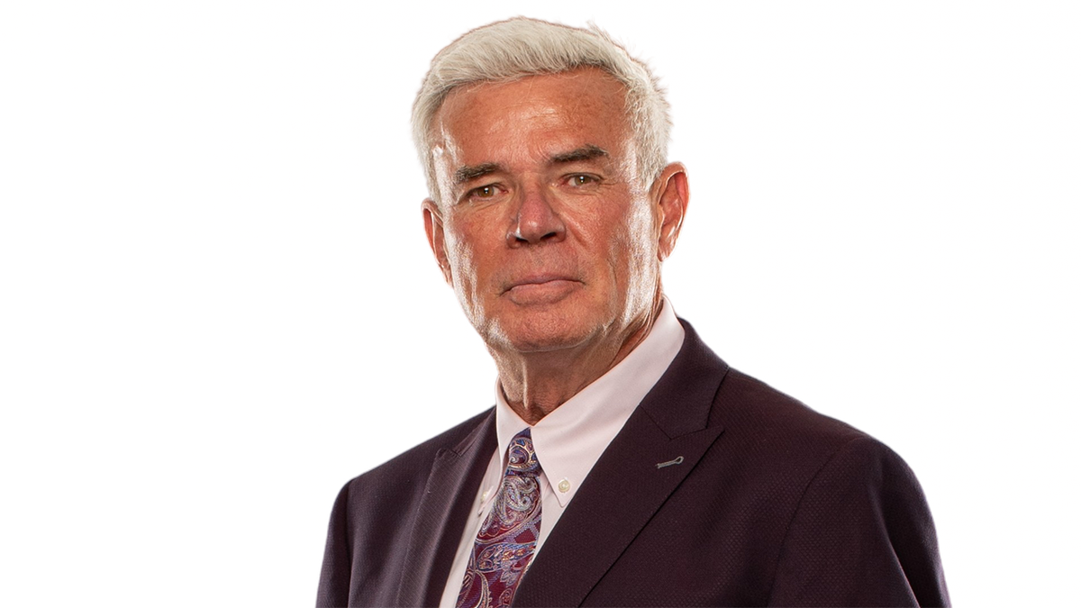 Eric Bischoff looks on