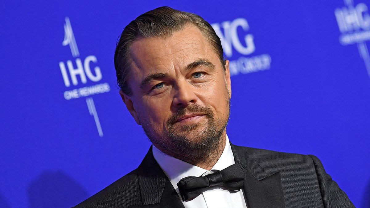 Leonardo DiCaprio looks serious on the carpet in a classic tuxedo