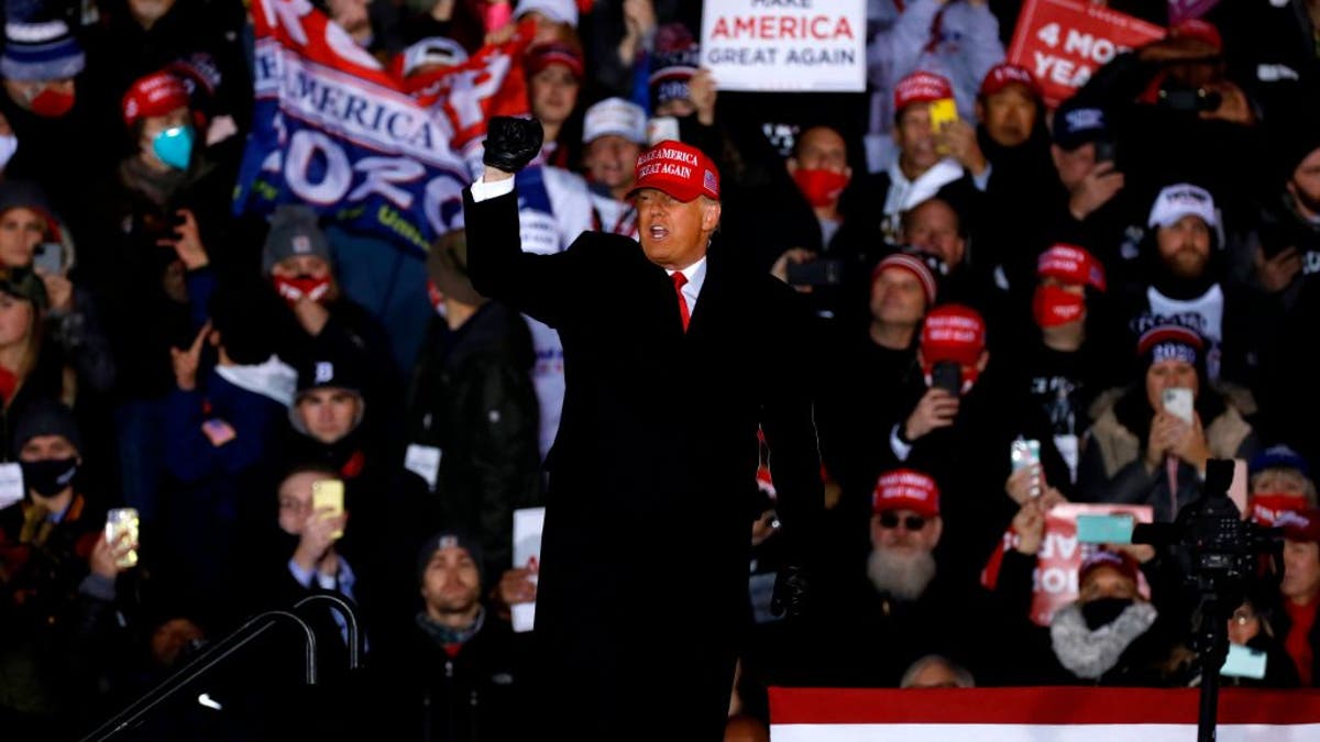 US President Donald Trump gestures at the end of his final Make America Great Again rally of the 2020 US presidential campaign at Gerald R. Ford International Airport on November 2, 2020, in Grand Rapids, Michigan . (Photo by JEFF KOWALSKY / AFP) (Photo by JEFF KOWALSKY/AFP via Getty Images)