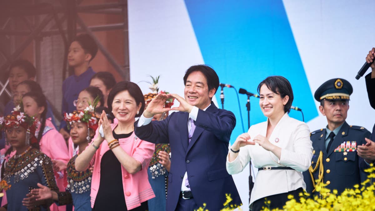 Taiwanese President Lai Ching-te, center, and his wife Wu Mei-Ju, left, with Vice President Hsiao Bi-khim gesture during his inauguration ceremony at the Presidential Palace in Taipei, Taiwan, on Monday, May 20, 2024.