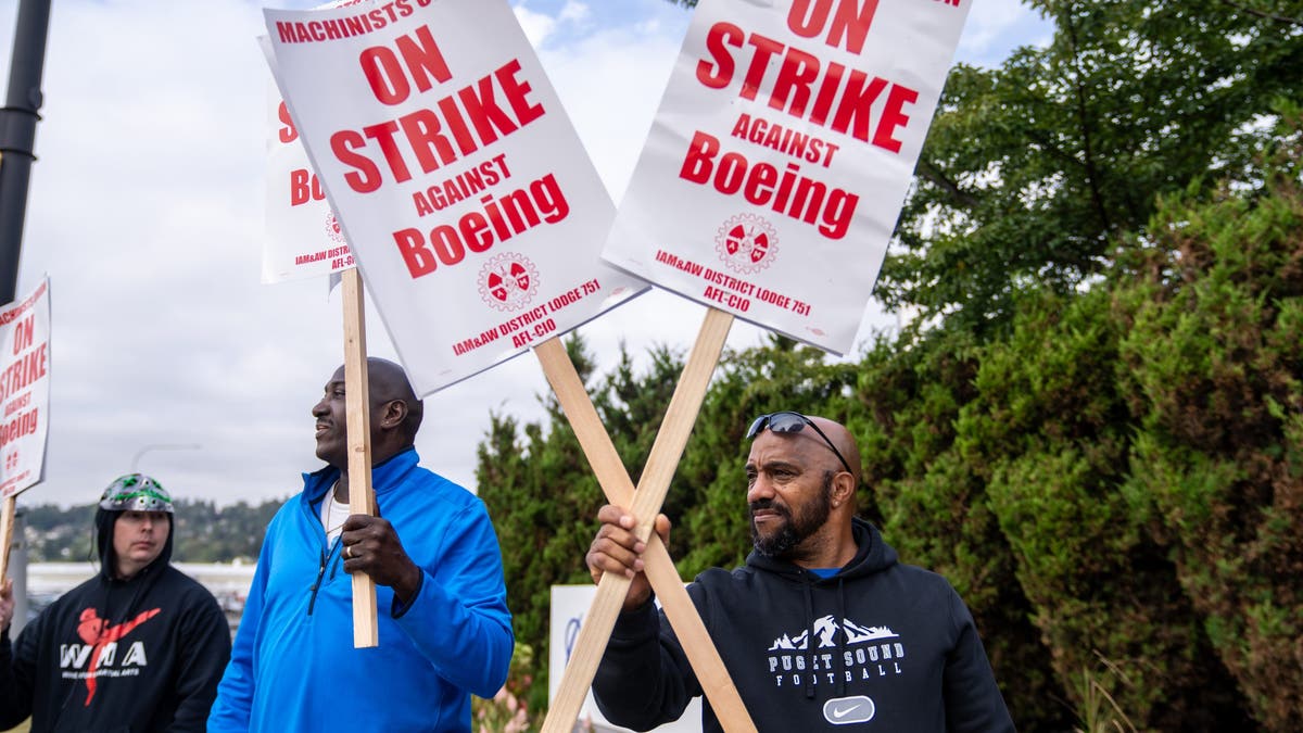 Boeing machinists union members picket outside a Boeing factory on Sept. 13, 2024 in Renton, Washington. The union voted overwhelmingly to reject the airplane maker's contract offer and strike.