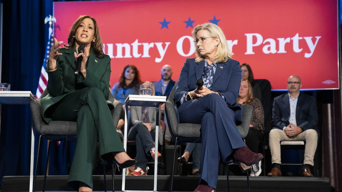 Vice President Kamala Harris, left, sits with former Rep. Liz Cheney, R-Wyo., for a town hall at the Royal Oak Music Theatre in Royal Oak, Michigan, on Oct. 21.