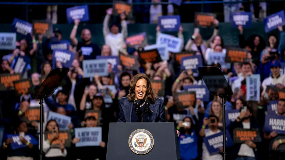 Kamala Harris at lectern at rally