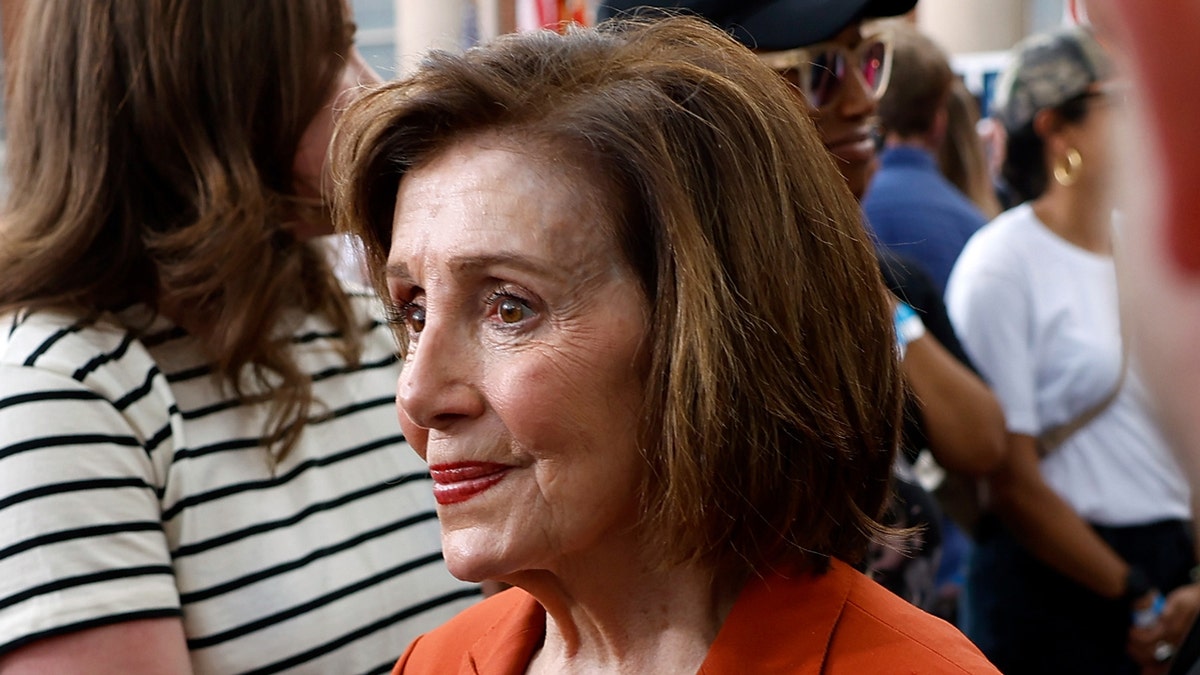 Pelosi smiling