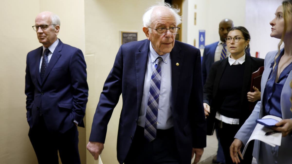 Sanders walking in hallway