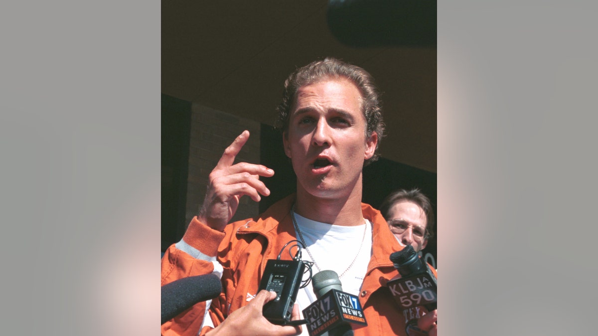 matthew mcconaughey talking to reporters outside the prison