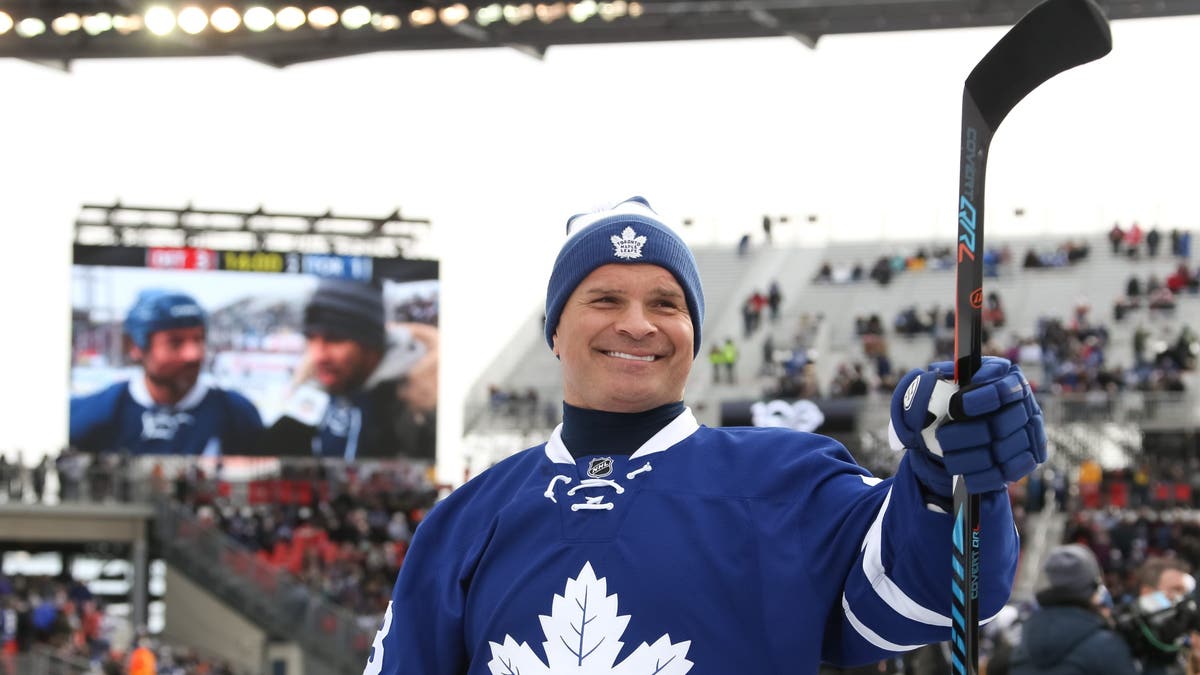 Tie Domi waves to fans