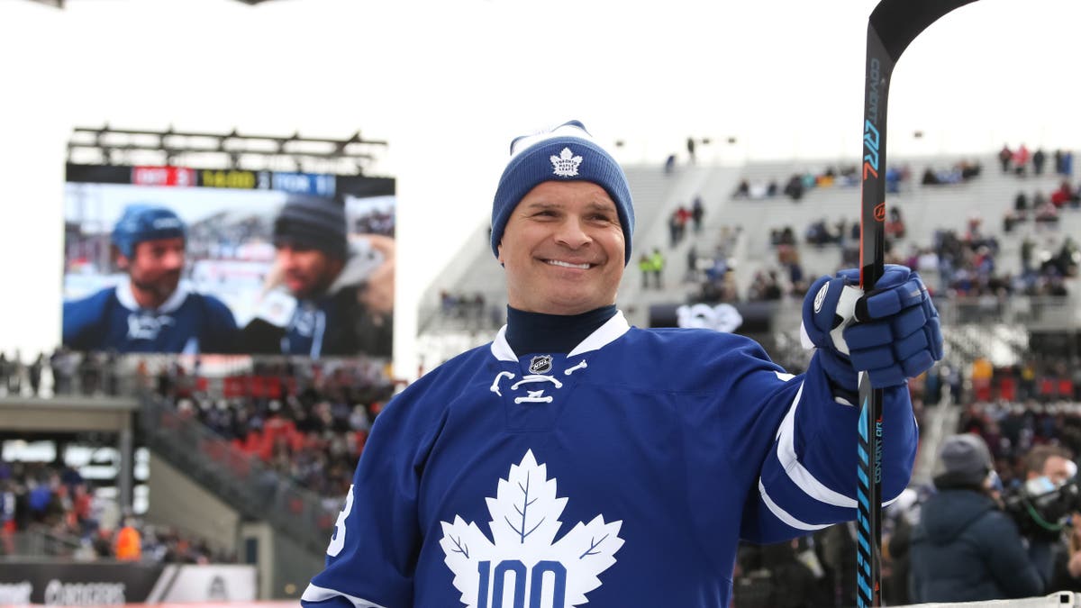 Tie Domi waves to fans