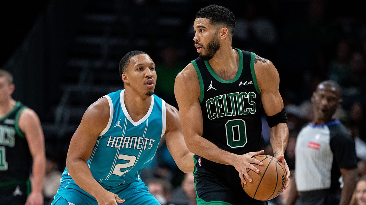 Grant Williams guards Jayson Tatum