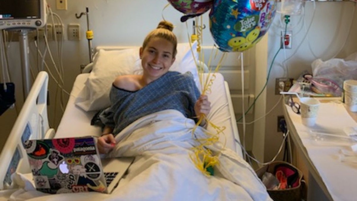 Woman in hospital bed.