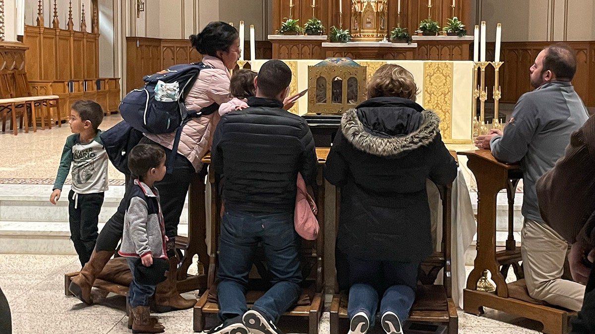 People venerating a relic