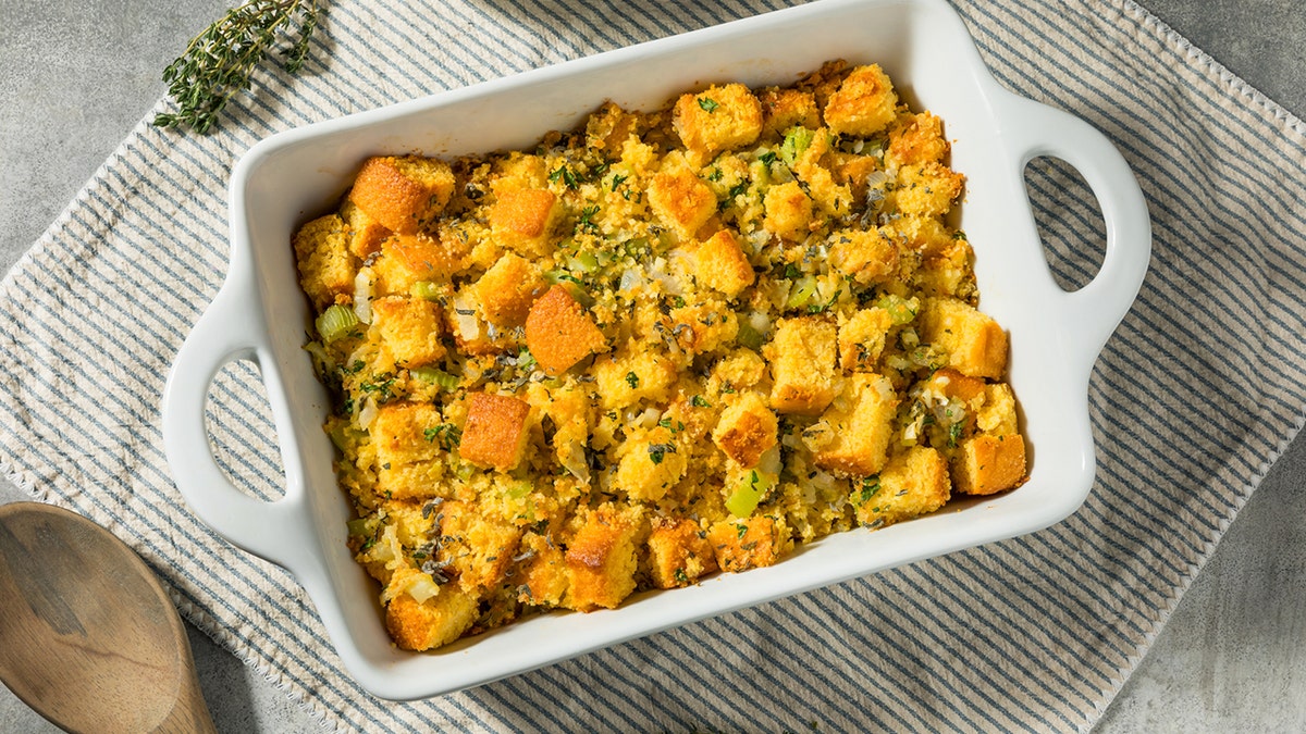 Homemade American Cornbread Stuffing in a white dish.