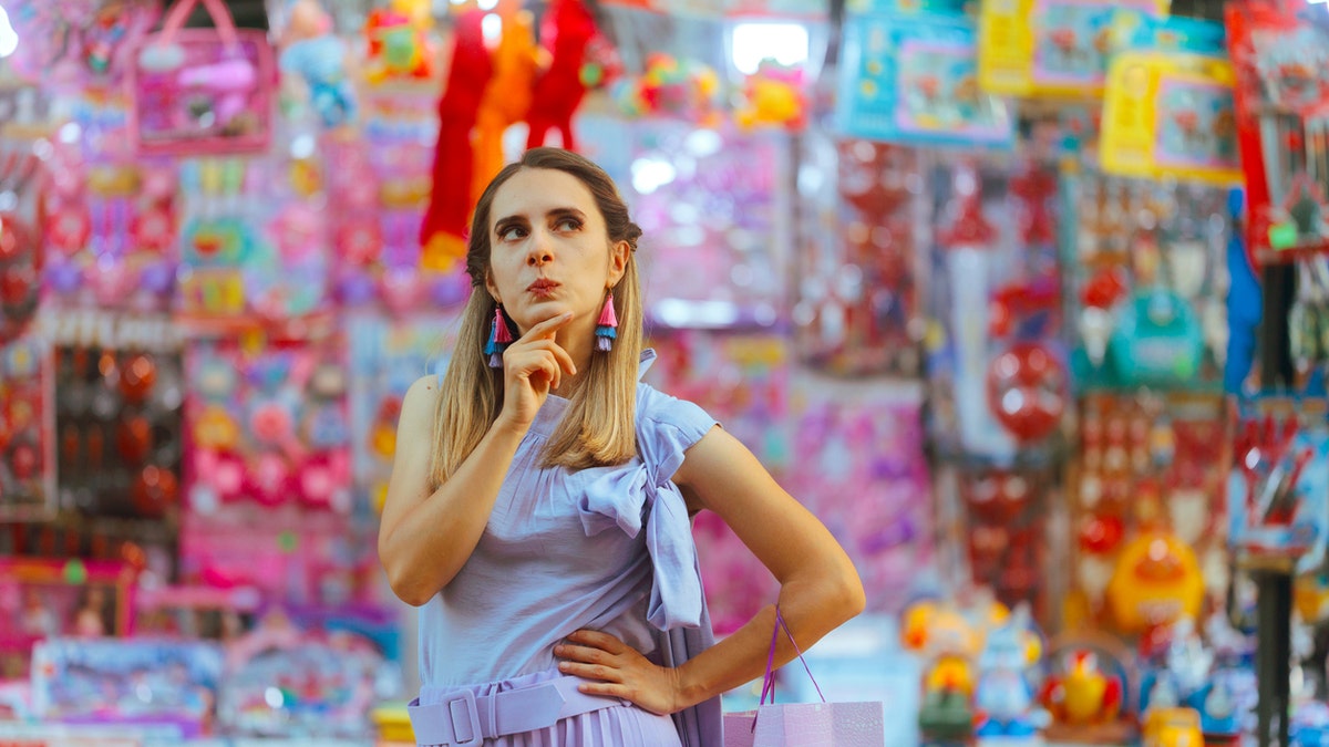 Funny Woman Thinking What to Buy in Outdoors Market Sale