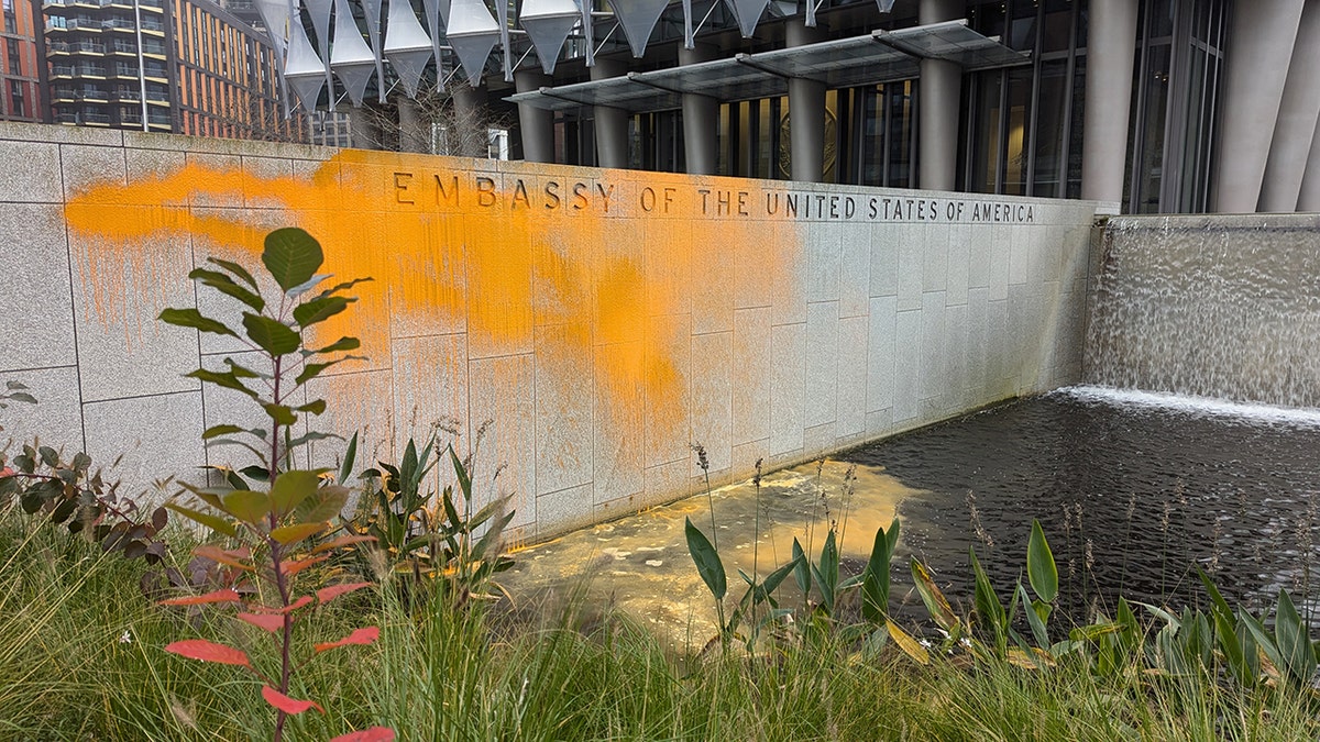 The exterior wall of the US Embassy in London is covered in orange paint