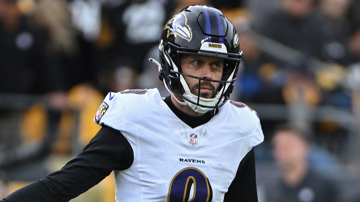 Justin Tucker reacts after hitting field goal