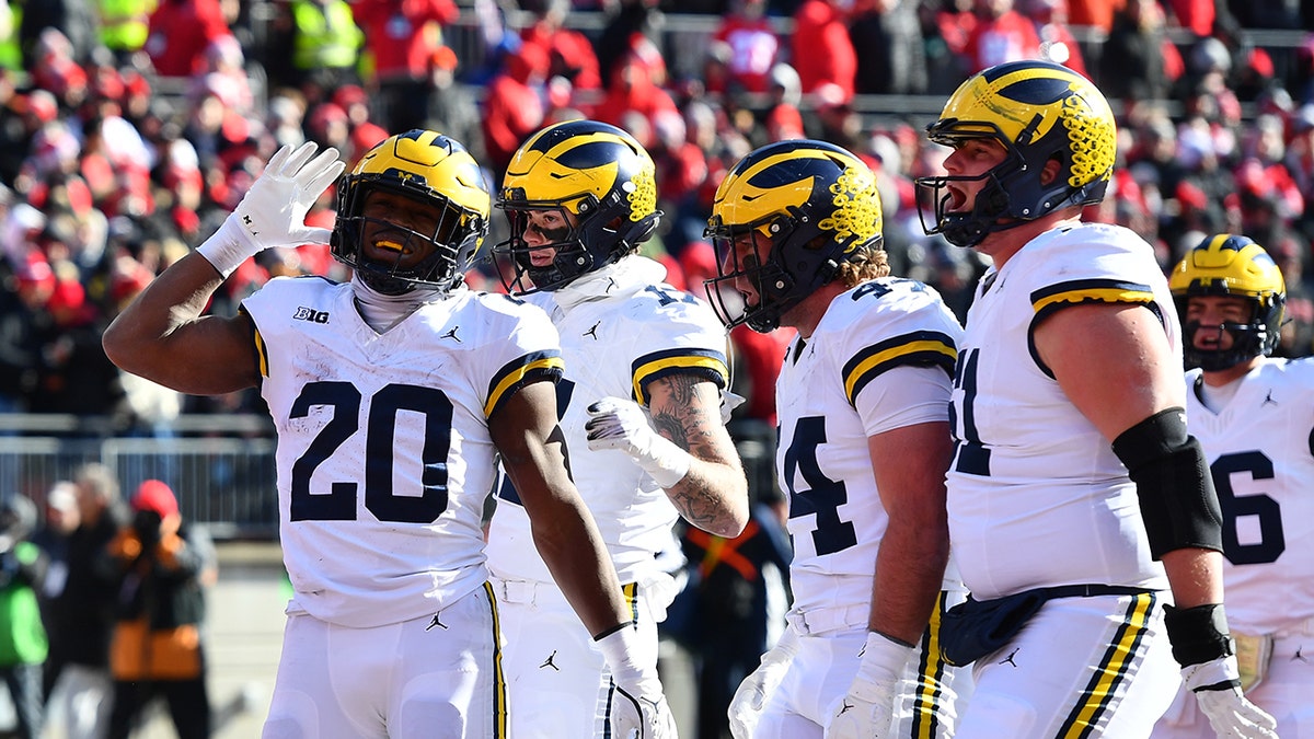 Kalel Mullings, #20 of the Michigan Wolverines, reacts after scoring a touchdown during the second quarter of a game against the Ohio State Buckeyes at Ohio Stadium on November 30, 2024, in Columbus, Ohio. (Photo by Ben Jackson/Getty Images)