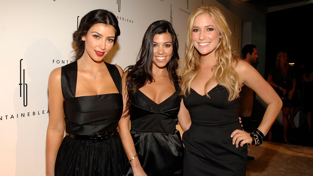 Kim Kardashian, Kourtney Kardashian and Kristin Cavallari each  deterioration  achromatic  dresses connected  the carpet