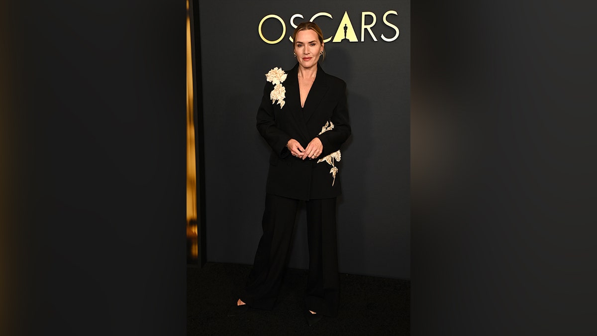 Kate Winslet wore a black suit with floral details to the Governors Awards.